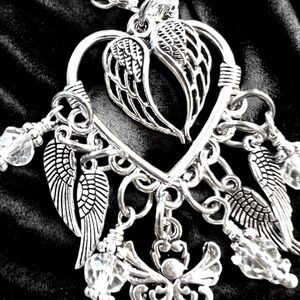 Angel wing necklace. Angel wing jewelry. Angels are everywhere. 19” long 2” drop